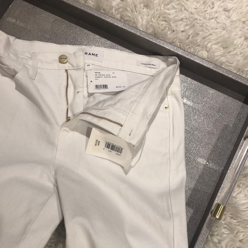 White Frame le Sylvie kick jeans.
